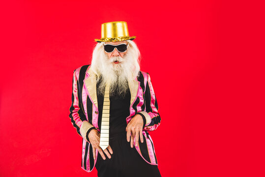 Stylish senior man portrait - Eccentric old man wearing fashionable clothing on colorful background