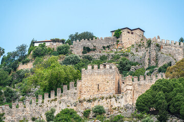 Fototapeta premium The scenic views of the Alanya Castle, surrounded by walls of 6 km length and situated on 10 hectares of the peninsula, hosted Hellenistic, Roman, Byzantine, Seljuk, Ottoman civilizations in Alanya