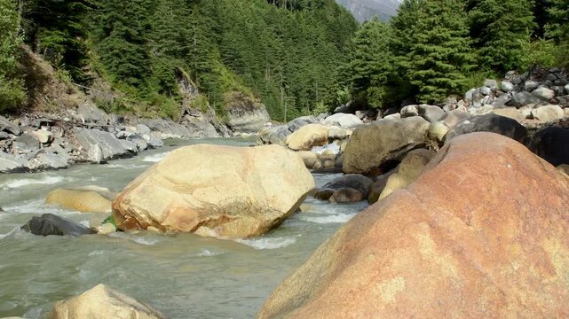 Bhagirathi river natural waterflow passing through rocks in Gangotri of UK