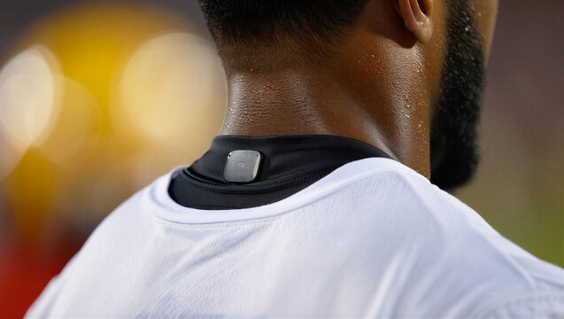 Closeup of a professional athlete wearing a gps tracking device on his neck