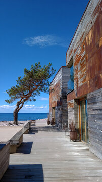 modern stilt house overlooking ocean, sleek coastal stilted home by the sea, luxury seaside villa on stilts with panoramic views