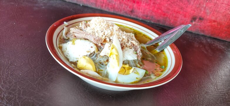 Lamongan soto is a traditional Indonesian soup made from broth, meat, and vegetables, with a distinctive style from the Lamongan region of East Java. A bowl of soto is ready to be enjoyed.