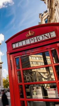 Classic red telephone boxes in London. Dowton London, Saint Paul's Cathedral, London, England, United Kingdom. Time lapse in vertical video.