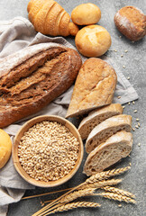 Naklejka premium Assorted fresh oven baked bread products with wheat