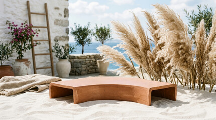 Fototapeta premium A serene outdoor scene featuring a star-shaped clay table surrounded by pampas grass, a sandy area, and lush plants against a beautiful seaside backdrop.
