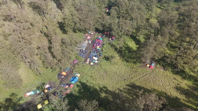 Aerial View of Vibrant Camping Site Surrounded by Lush Greenery and Nature's Beauty