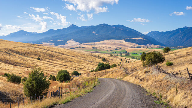Sunny September Morning On A Gravel Back Road Looking At The Wallowa Mountains