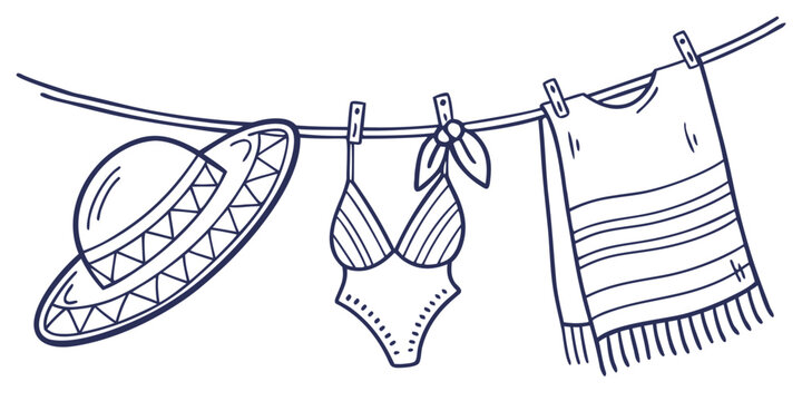 Summer clothes drying on clothesline with sombrero and poncho