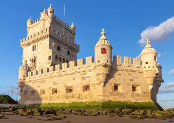 Fototapeta premium Belem Tower at low tide on Tagus River waterfront in Lisbon Portugal