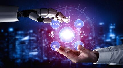 Obraz premium Futuristic Collaboration Between Human Hand and Robotic Hand with Digital Interface Around Plan Do Act and Change Concepts. Bitwise.