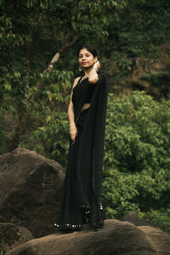 Cinematic Portrait of Indian Girl in Black Saree at Athirappilly Falls