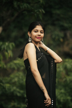 Cinematic Portrait of Indian Girl in Black Saree at Athirappilly Falls