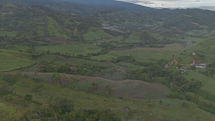 Naklejka premium Panoramic aerial view of panela crops and green mountains in Boyacá