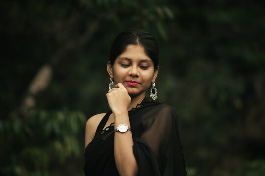 Cinematic Portrait of Indian Girl in Black Saree at Athirappilly Falls