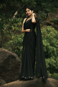 Cinematic Portrait of Indian Girl in Black Saree at Athirappilly Falls