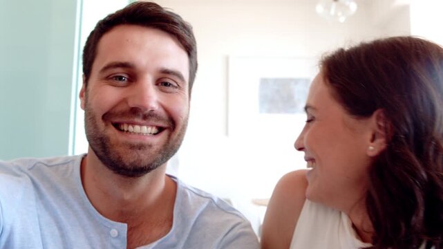 Happy, home and face of couple on video call for talking, chat and recording for social media. Marriage, pov and portrait of man and woman for connection, communication and virtual conversation