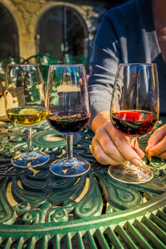 port wine testing, glasses with drink woman holding one