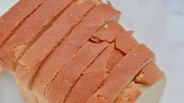 Close-up of fresh and appetizing sliced bread, perfect for a delicious breakfast. Fresh, fluffy, and irresistible sliced bread in a close-up that whets the appetite.