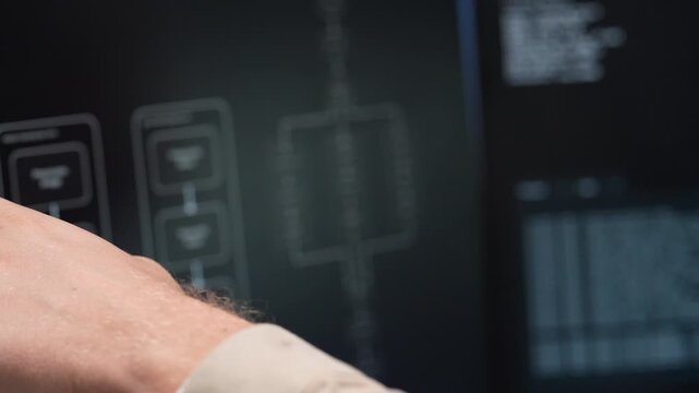 Close up view of a desktop computer screen displaying complex software database coding lines and a digital interface layout during a tech startup session.