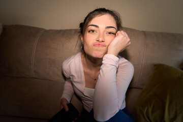 Obraz premium Young woman showing boredom and frustration at home