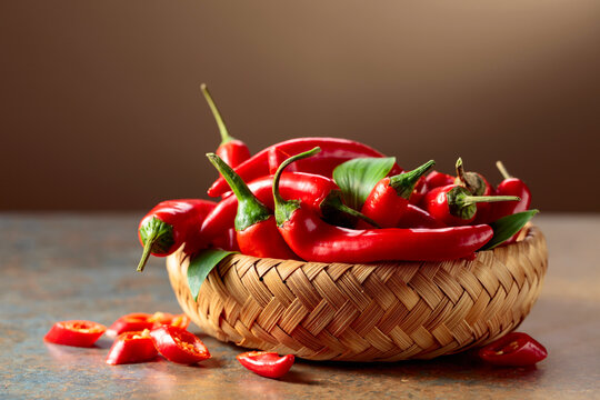Red hot chili peppers in wicker dish.