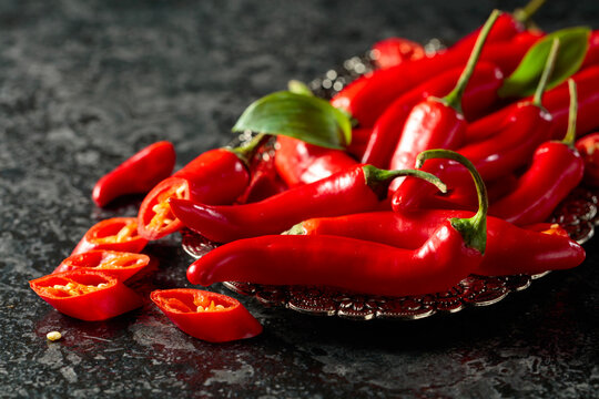 Red hot chili peppers on a silver tray.
