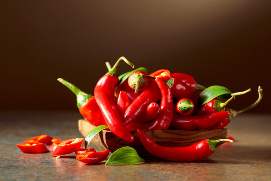 Red hot chili peppers in wooden dish.