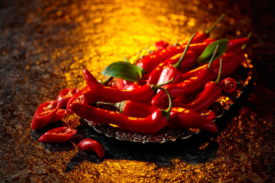 Red hot chili peppers on a silver tray.