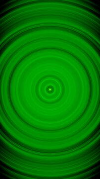 Mesmerizing hypnotic green circle waves expanding on black background. Seamless loop 4K vertical footage.