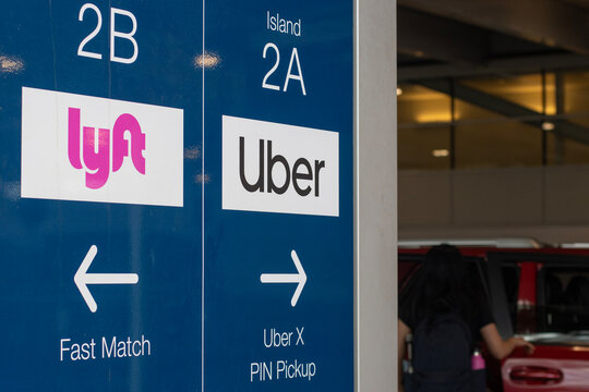 Portland, OR, USA - July 9, 2022: Designated ride-share pickup area for Uber and Lyft drivers and passengers at Portland International Airport.
