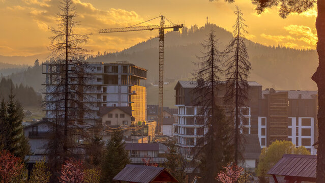 Sunset over a construction site in a scenic mountainous area