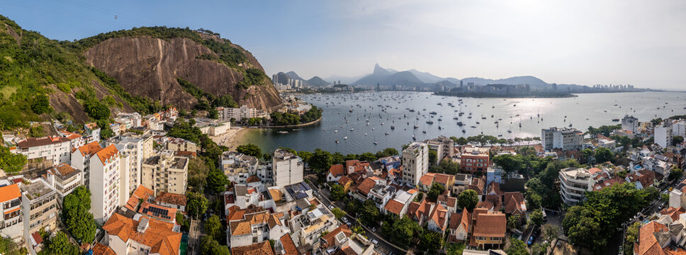 Aerial view of Urca neighborhood and Guanabara Bay with boats anchored in the water and Corcovado mountain in the distance Rio de Janeiro, State of Rio de Janeiro, Brazil.