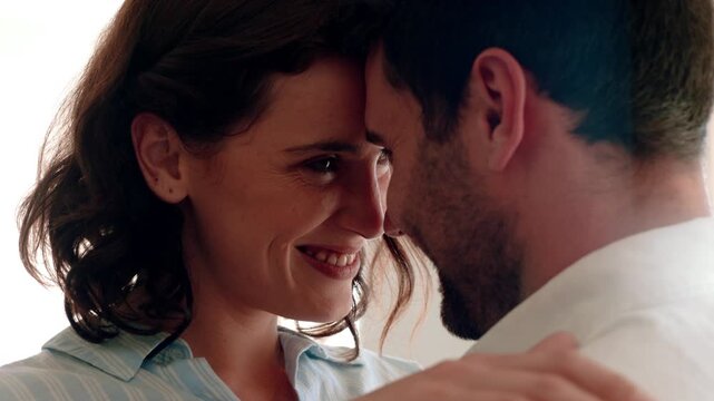 Couple, smile and hug in home, love and romance with partner and commitment for relationship or care. Happy people, support and embrace with spouse on weekend, woman and bonding with man and comfort