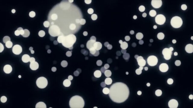 Luminous white and light grey particles gracefully drift and swirl against an infinite, deep black void, creating a dynamic 3D field with subtle bokeh and shallow depth of field, resembling ethereal