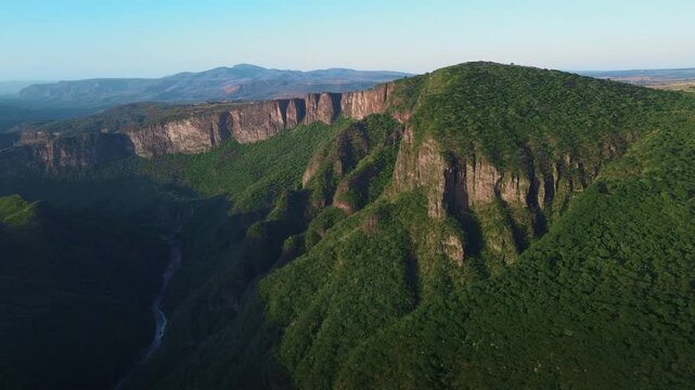 Majestic Santiago River and Mountain Canyon at Sunset Featuring a Cinematic Aerial Drone Push In View of Lush Green Forests in Guadalajara Mexico