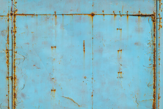 Weathered Stitched Blue Metal Surface with Rust Stains
