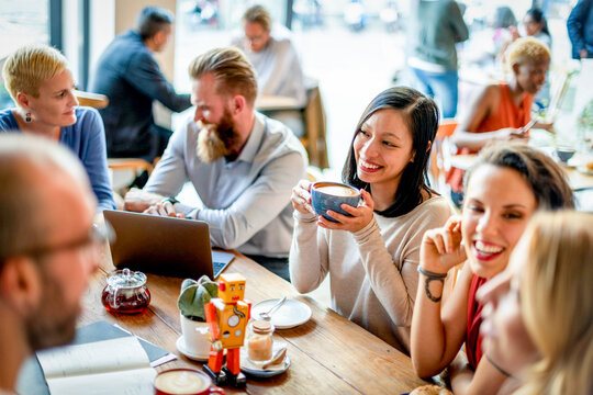 Diverse group enjoying coffee together