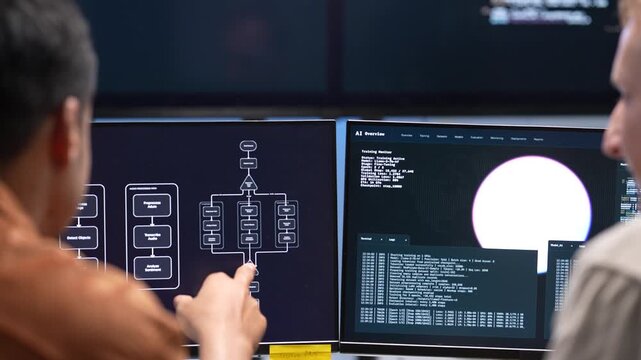 Close up view of tech specialists using a stylus to analyze software source code lines and digital interface graphic elements on a desktop computer monitor.