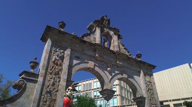 The Historic Zapopan Arches Monument and Fountain Featuring a Cinematic Aerial Drone Push In Flight Revealing the Zapopan Basilica in Downtown Jalisco Mexico