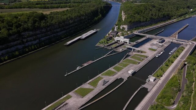 Barge travels through Ecluse de Lanaye lock on the Maas near Belgium and Netherlands border