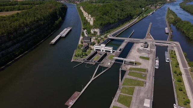 Barge sailing through the Ecluse de Lanaye on the river Maas near the Belgium and Netherlands border