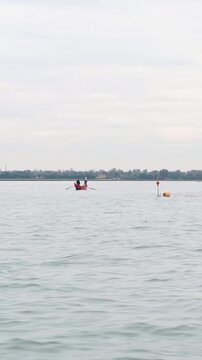 Traditional Gondola in Murano Lagoon Seen from the Sea in Venice Italy