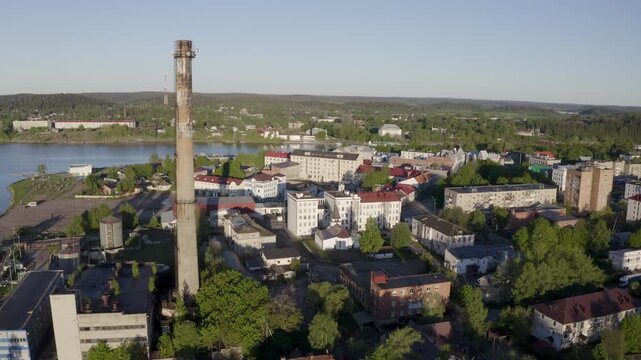 Forward reveal aerial shot of Sortavala town on sunny summer morning. Karelia, Russia.