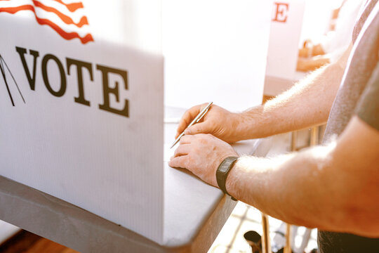 Person voting in election booth