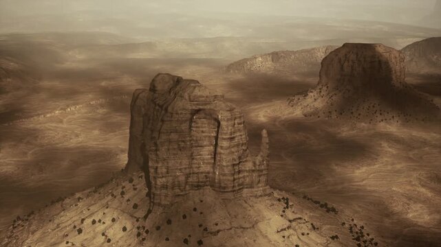 Massive sandstone monolith with textured faces, vertical cliffs, shadowed crevices, sparse scrub, warm beige tones, visible stratification, tactile rock