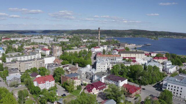 Forward reveal aerial footage of Sortavala town on sunny summer day. Karelia, Russia.