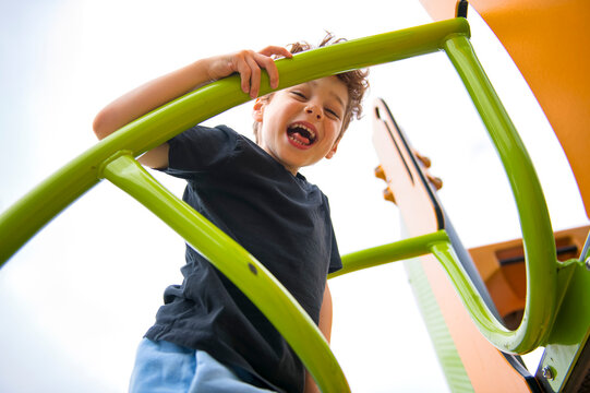 Happy kid on playground on summer season