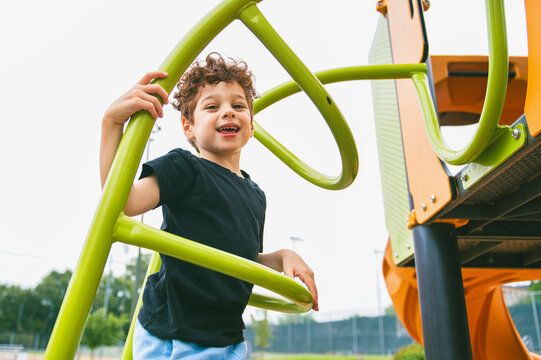 Happy kid on playground on summer season