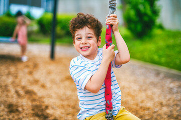 Plakat Happy 5 years old girl on a playground
