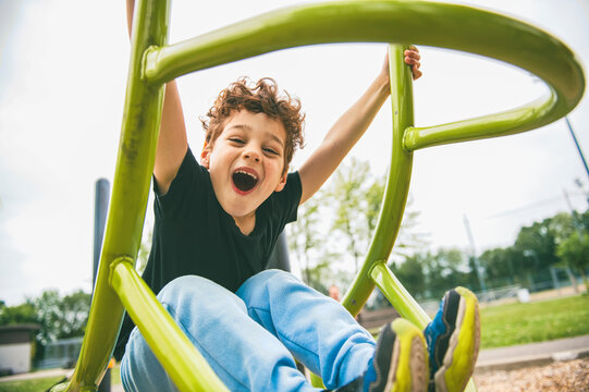 Happy kid on playground on summer season